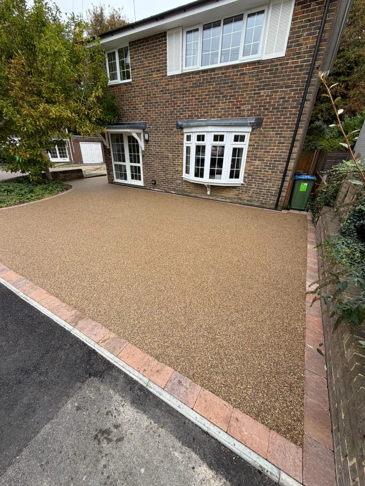 A house with a driveway in front of it.